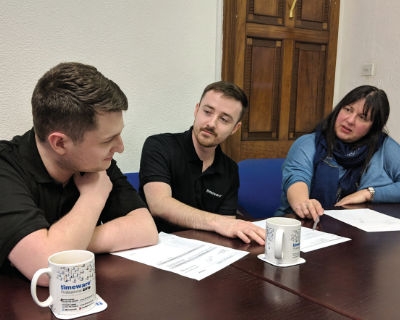 Mike Coope, Harry Archer and Liz discussing SLA3 annual upgrades.